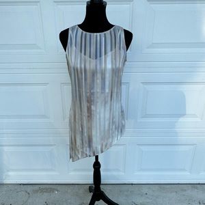 Beautiful asymmetrical sleeveless top. The perfect neutral layering piece